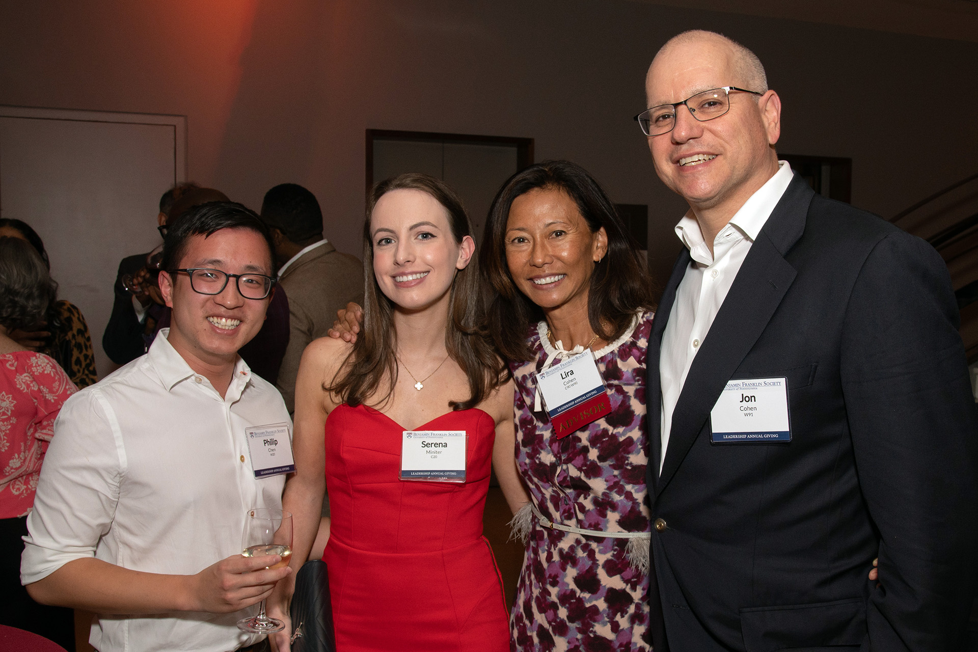 Philip Chen, W’20, and Serena Miniter, C’20, paused for a photo alongside fellow Penn alumni Lira, C’90, W’90, and Jon Cohen, W’91.