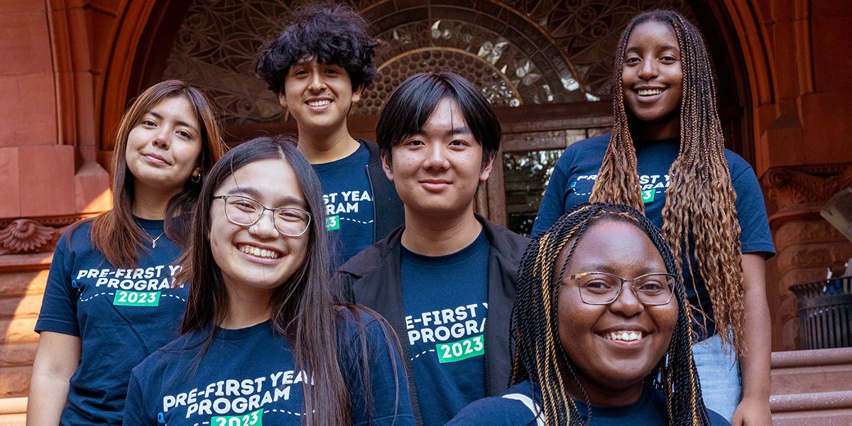 Participants in Penn's Pre-First Year Program pose together on the steps of Fisher Fine Arts Library at the University of Pennsylvania