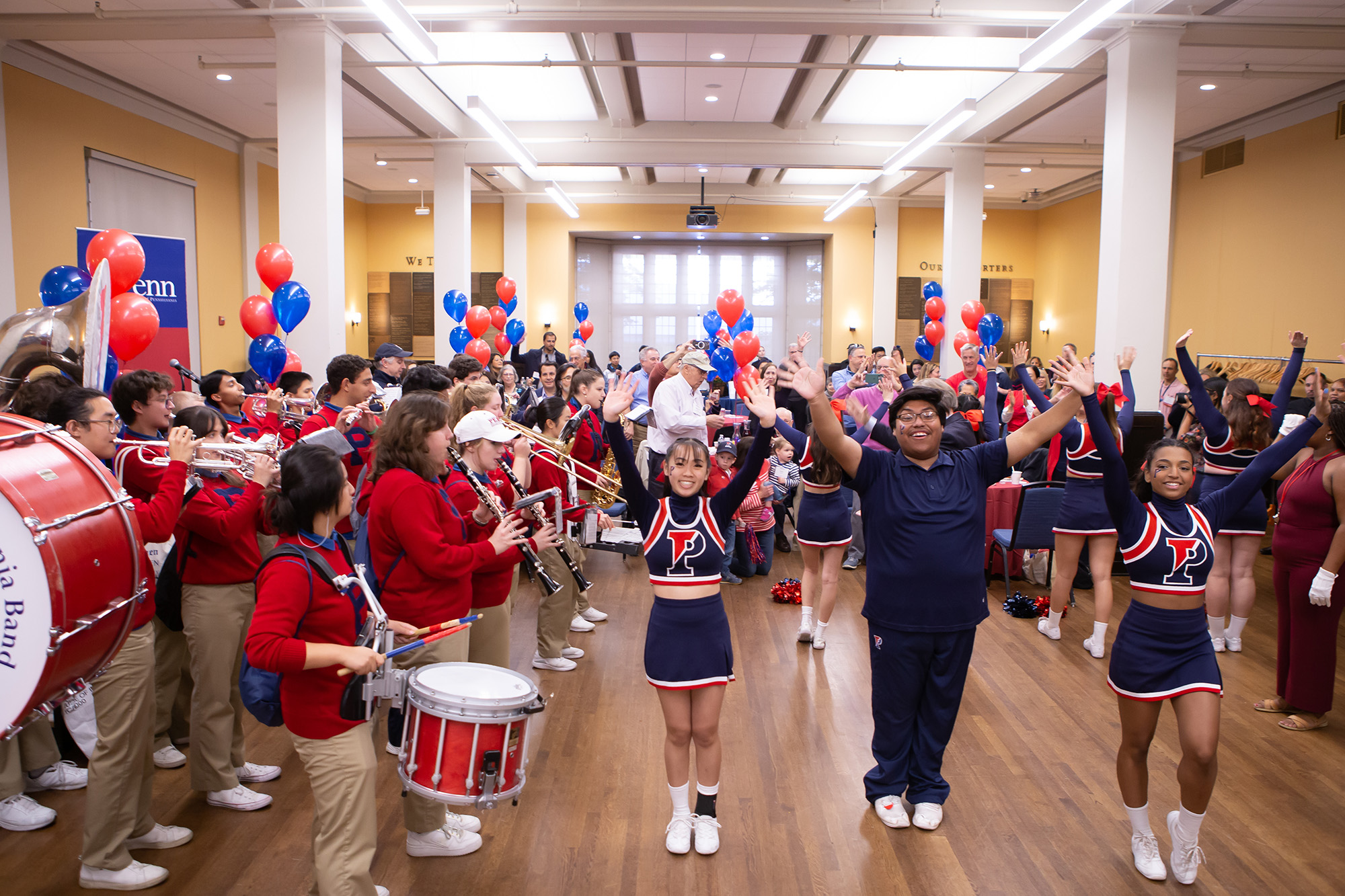 The Penn Band and Penn Cheerleading perform and drum up excitement during the 2022 Homecoming Brunch for members of the Benjamin Franklin Society at the University of Pennsylvania.