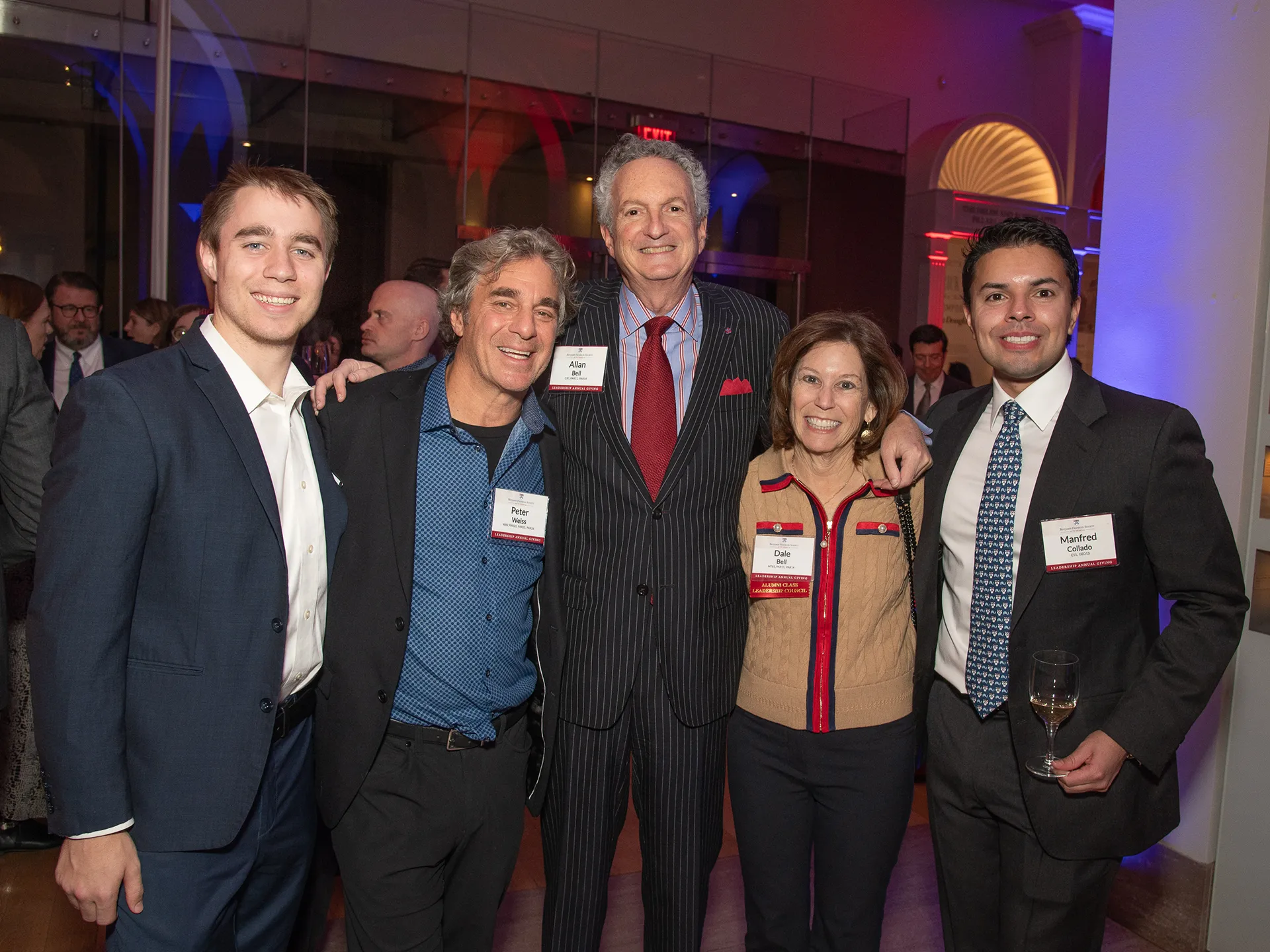 Five Benjamin Franklin Society members pose for a group photo at the Spring Reception, smiling as they celebrate 70 years of leadership annual giving.