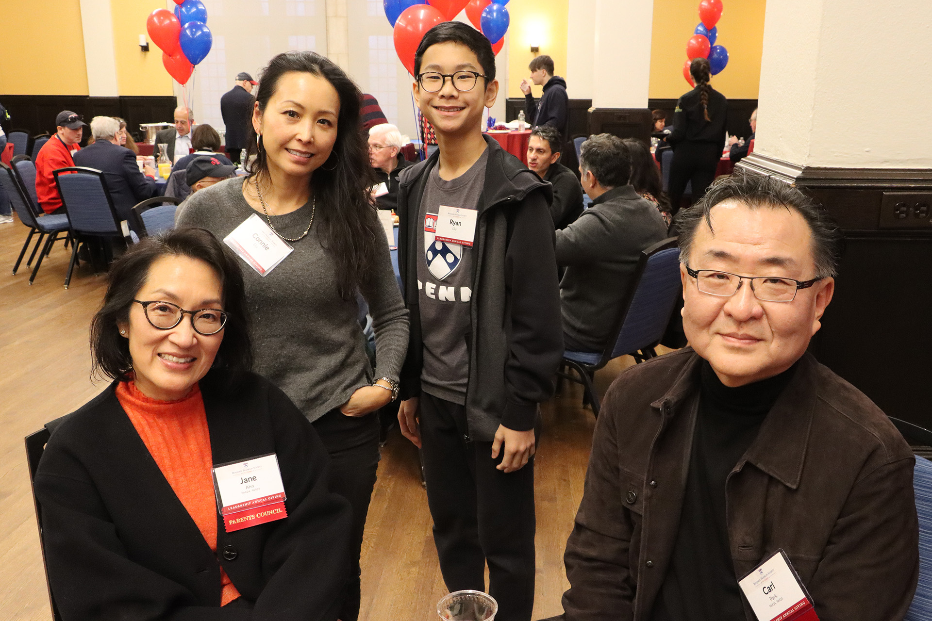 A family of four poses for a photo at the 2024 Benjamin Franklin Society Brunch.