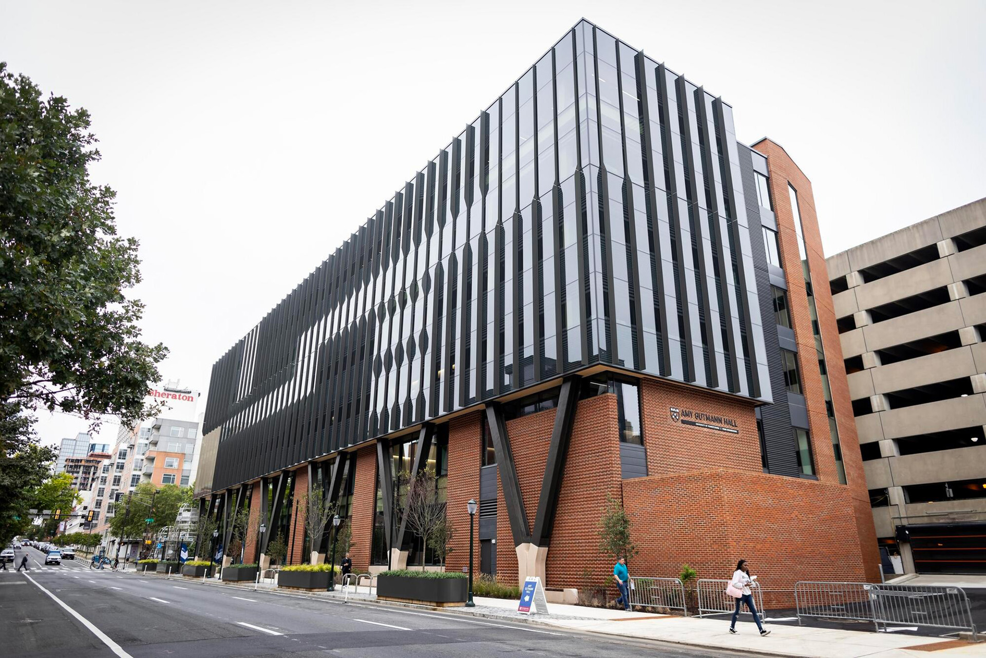 An exterior view of Amy Gutmann Hall from the ground level.