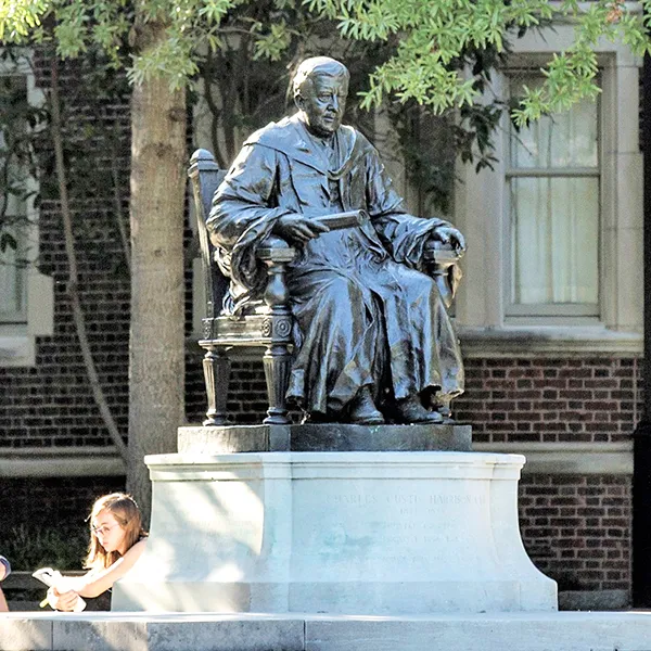 Students gathered near the Charles C. Harrison statue in the Quad at the University of Pennsylvania.