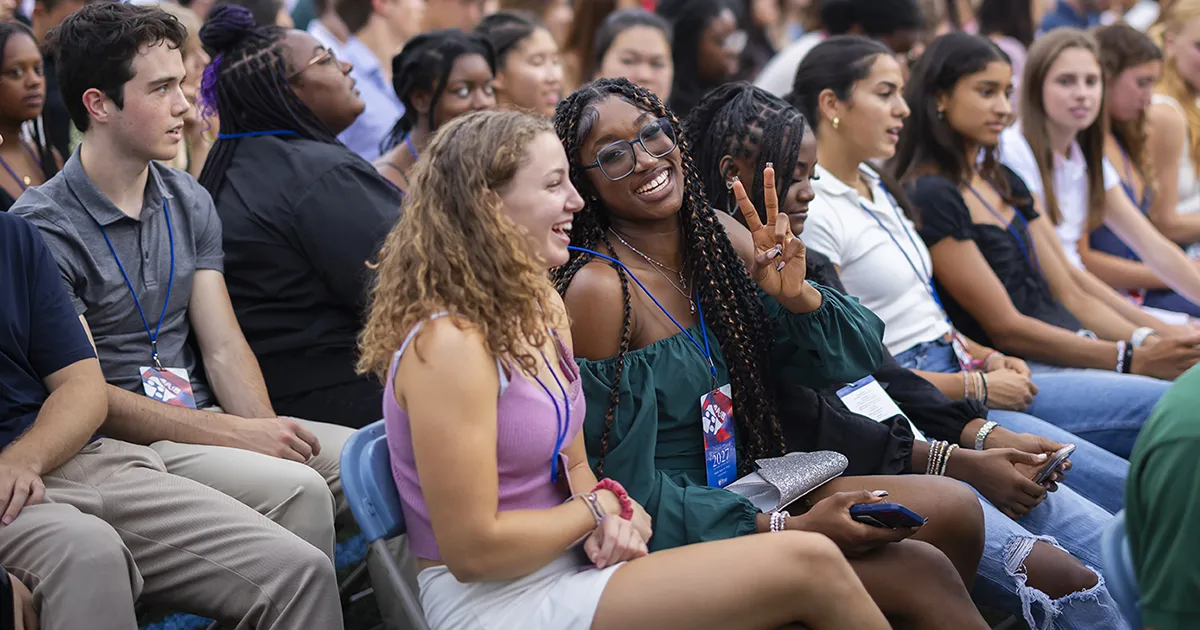 Incoming Penn students smile and chat during Convocation, representing the sense of community supported by The Penn Fund.