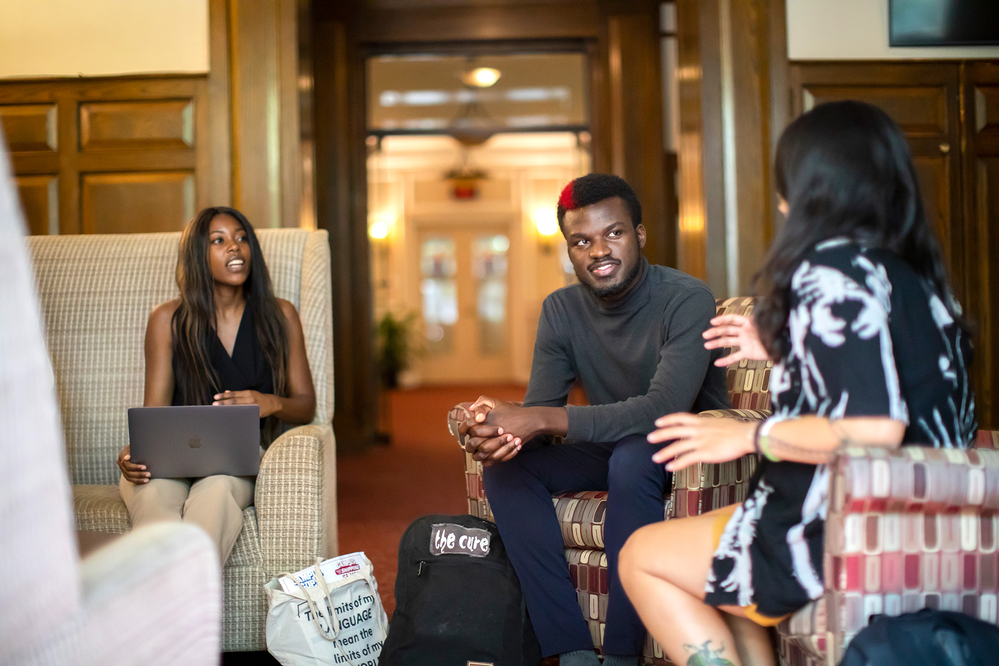 Gianni Morsell, Josh Arinze, and Joelle Eliza Lingat, students in the Social Justice Scholars Program at the University of Pennsylvania School of Social Policy and Practice, sit together for a conversation.